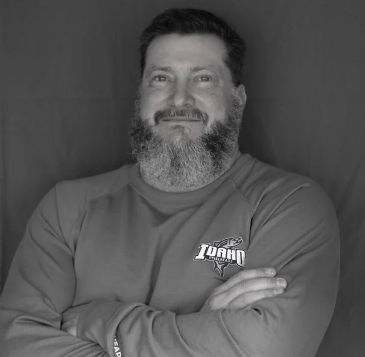 Dr. Steve Maier smiling in an Idaho Steelheads pullover